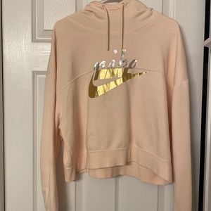 Light pink Nike pullover cropped hoodie.
